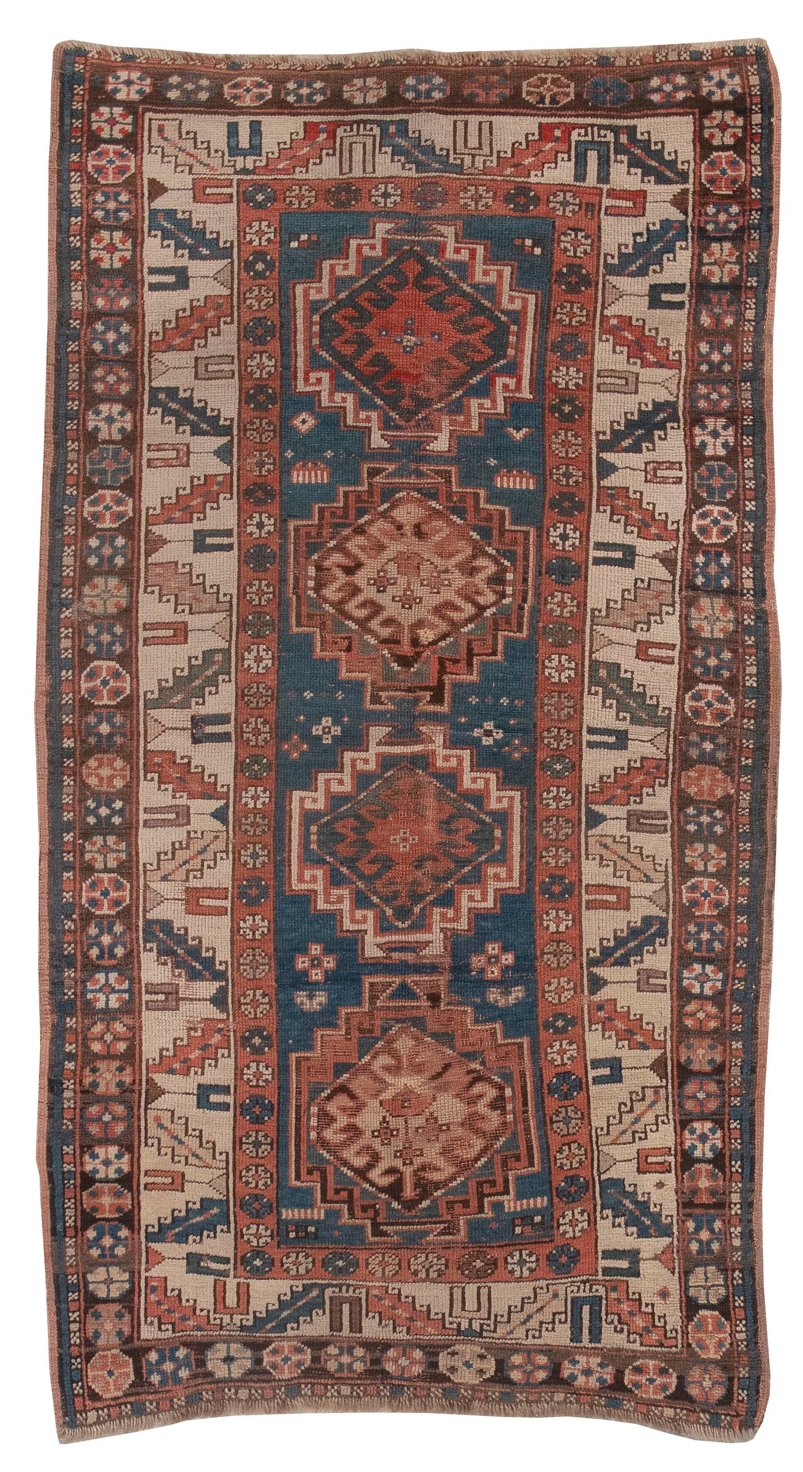 KAZAK RUG: 3'5" X 6'3" Late 19th Century: KAZAK RUG: 3'5" X 6'3" Late 19th Century Marine blue field with geometric medallions featuring central latch hook elements in brick red, teal, green, brown, ivory and faded yellow. Brick red and abras