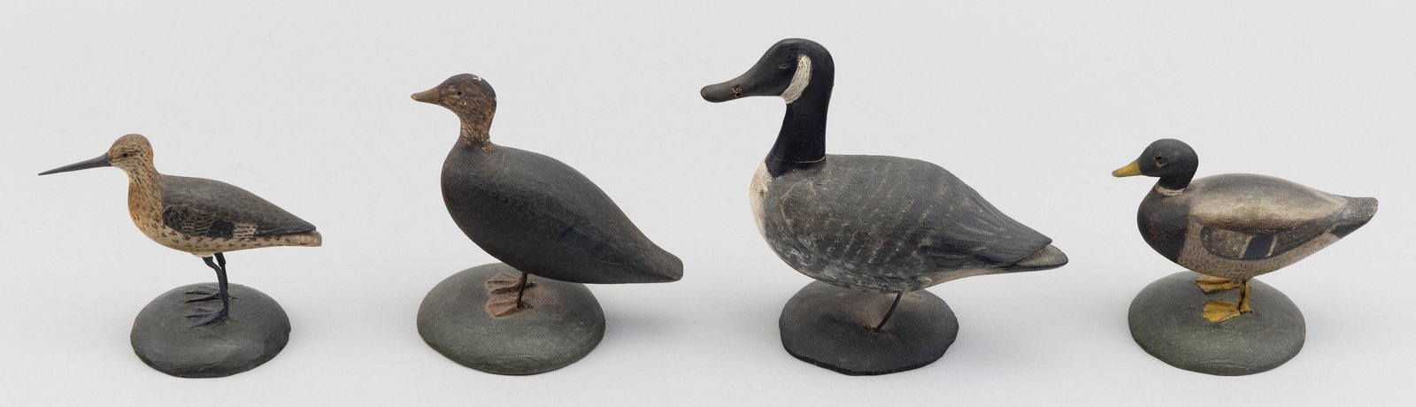 FOUR MINIATURE BIRD CARVINGS Early 20th Century Heights from 2.5" to 4". (1 of 3)