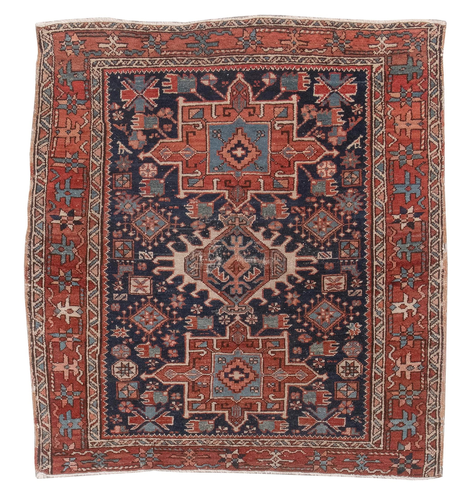 KARAJA RUG: 3'6" X 4'0" First Quarter of the 20th Century: KARAJA RUG: 3'6" X 4'0" First Quarter of the 20th Century Rust red, blue and ivory geometric medallions are surrounded by various stylized elements on a dark blue field. Serpentine stylized leaves and