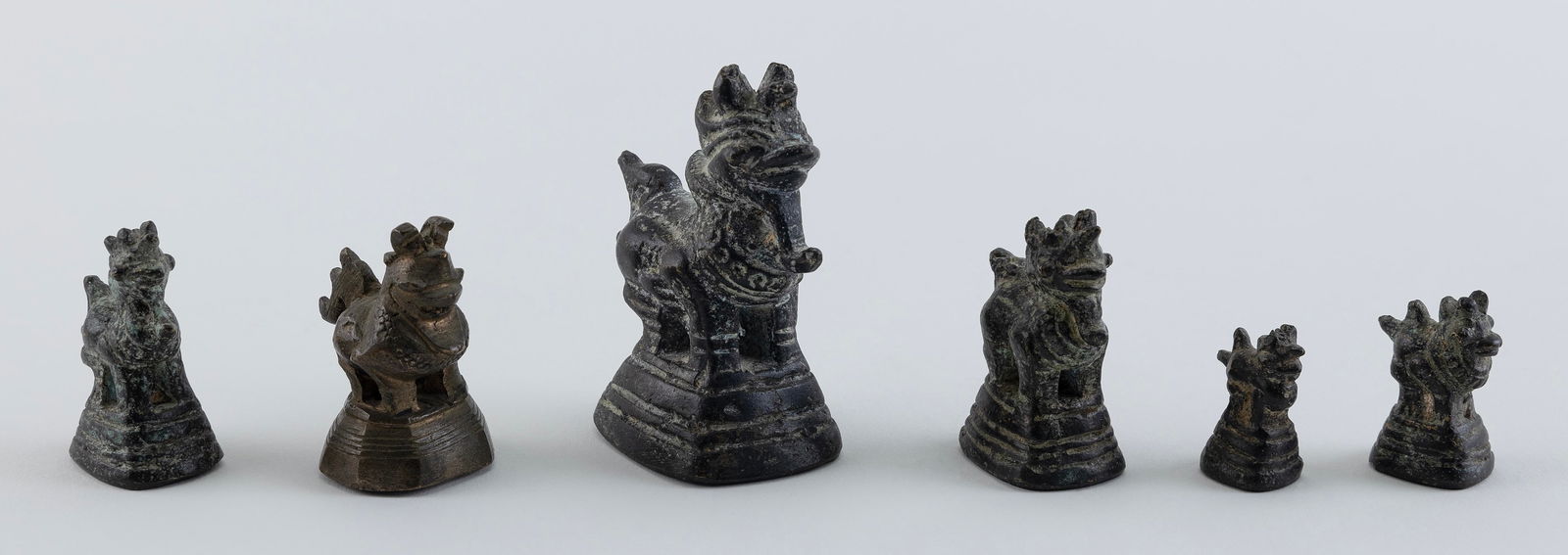 ASSEMBLED SET OF SIX BURMESE BRONZE OPIUM WEIGHTS 19th Century Heights from 1" to 3.5". (1 of 2)