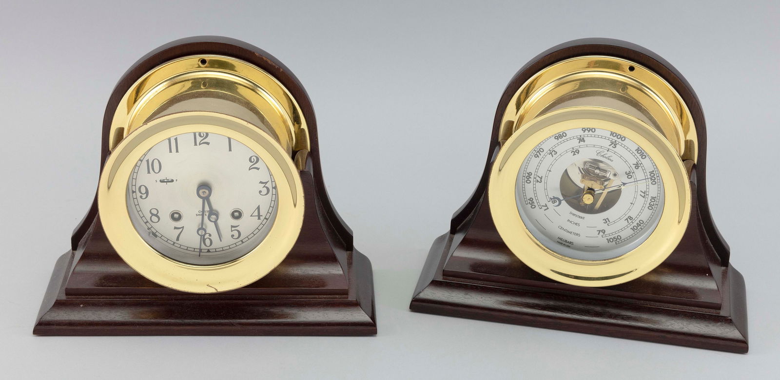 CHELSEA SHIP'S BELL CLOCK AND BAROMETER SET Boston, 20th Century Total heights 7.5". Bezel diameters (1 of 2)