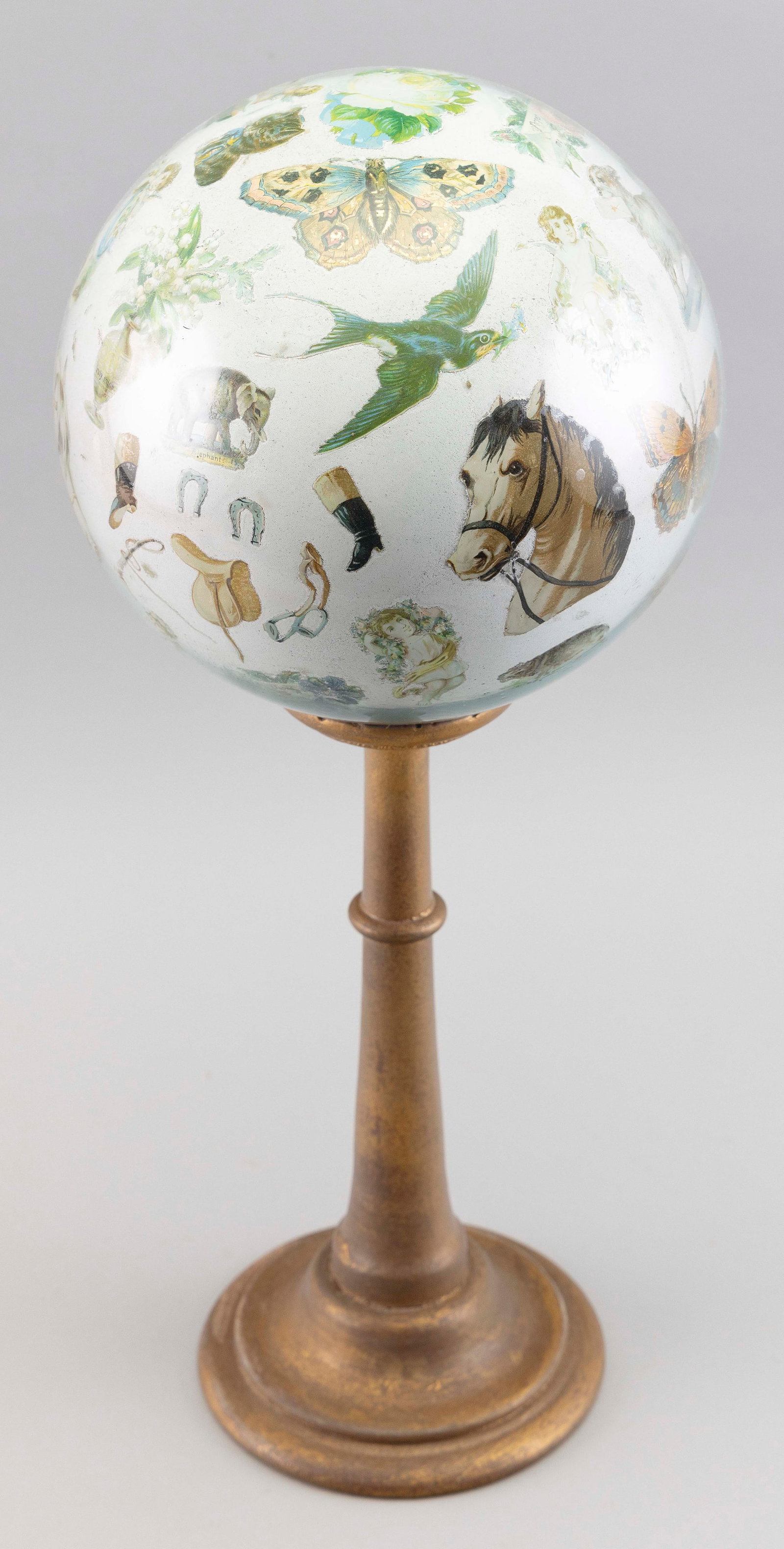 POTICHOMANIA BLOWN GLASS WITCH BALL Late 19th Century Height 18".: POTICHOMANIA BLOWN GLASS WITCH BALL Late 19th Century Mounted on a giltwood stand. Height 18".