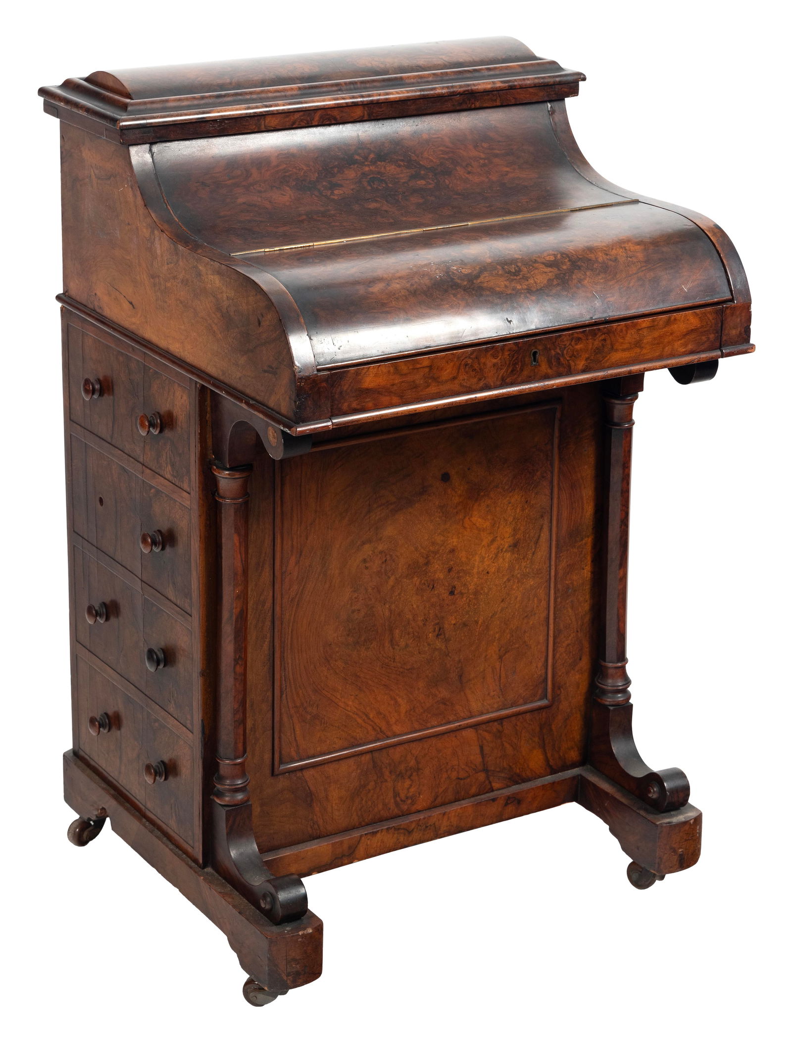 DAVENPORT DESK 19th Century Height 36". Width 23". Depth 21".: DAVENPORT DESK19th CenturyIn burled walnut and burled walnut veneer. Roll top opens to reveal a fitted interior. Rear compartment lifts open separately. Paneled front with carved side columns. Four wo