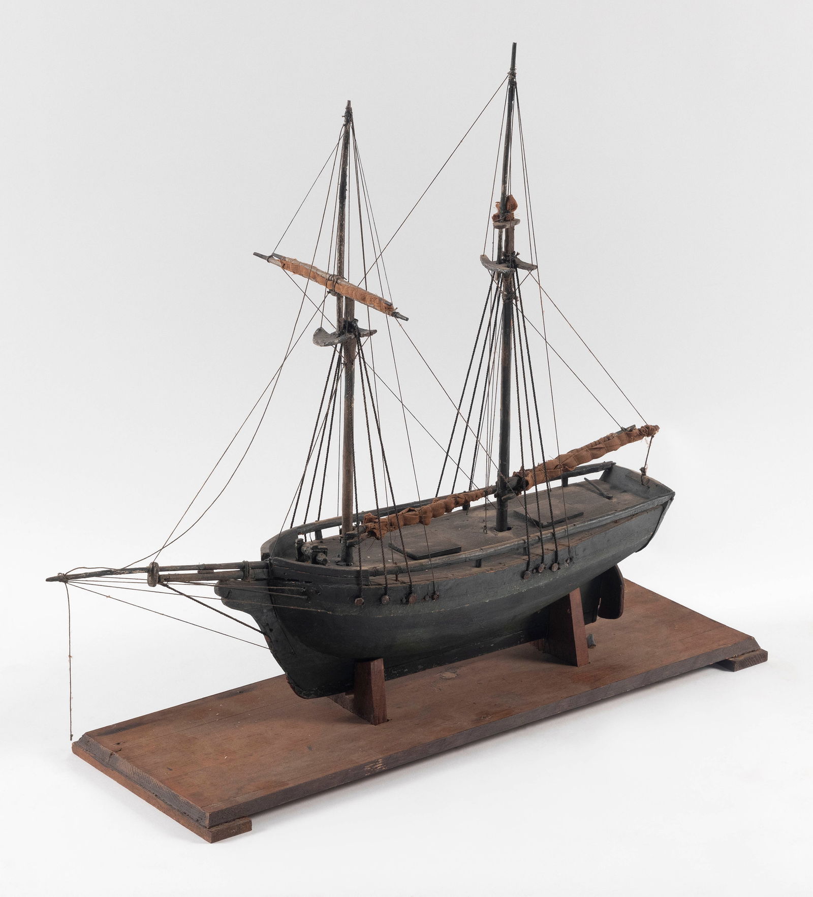 MODEL OF A TWO-MASTED SHIP Early 20th Century Height 20.5". Length 23.5". Width 7.5". (1 of 2)