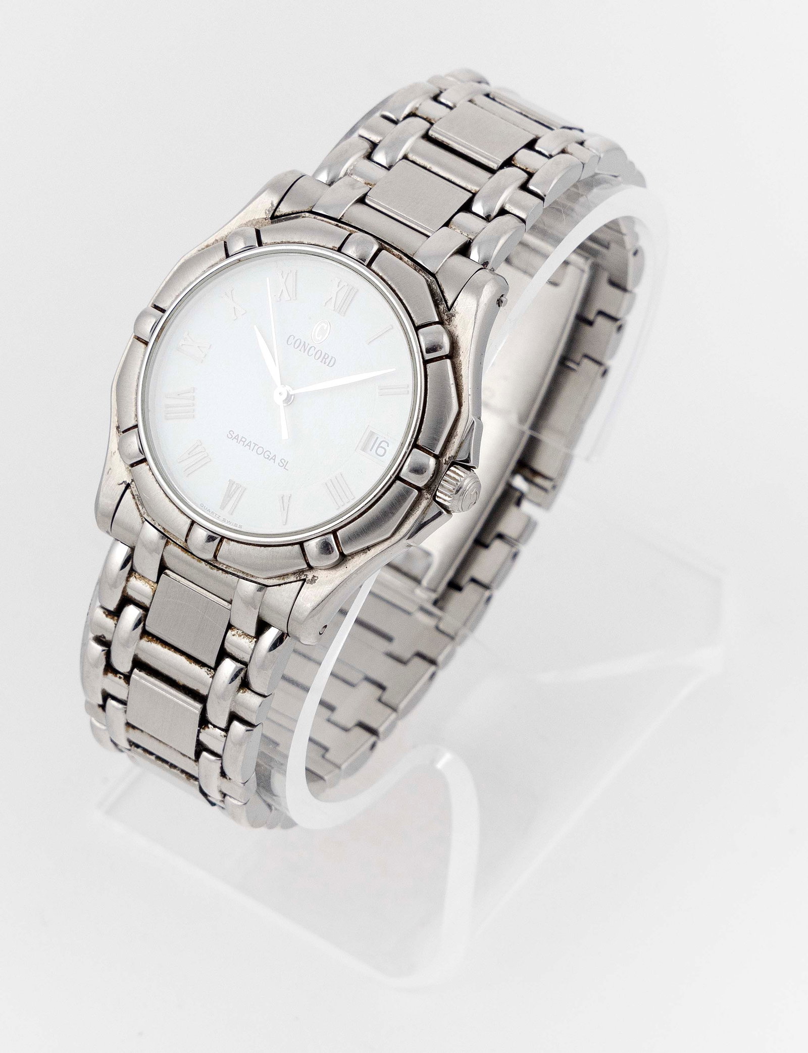 CONCORD SARATOGA STAINLESS STEEL WATCH: CONCORD SARATOGA STAINLESS STEEL WATCH Case engraved with Saratoga logo and "14-C2-230 1025975 Water Resistant 5 ATU". Swiss quartz movement. White dial with black Roman numerals, date windo
