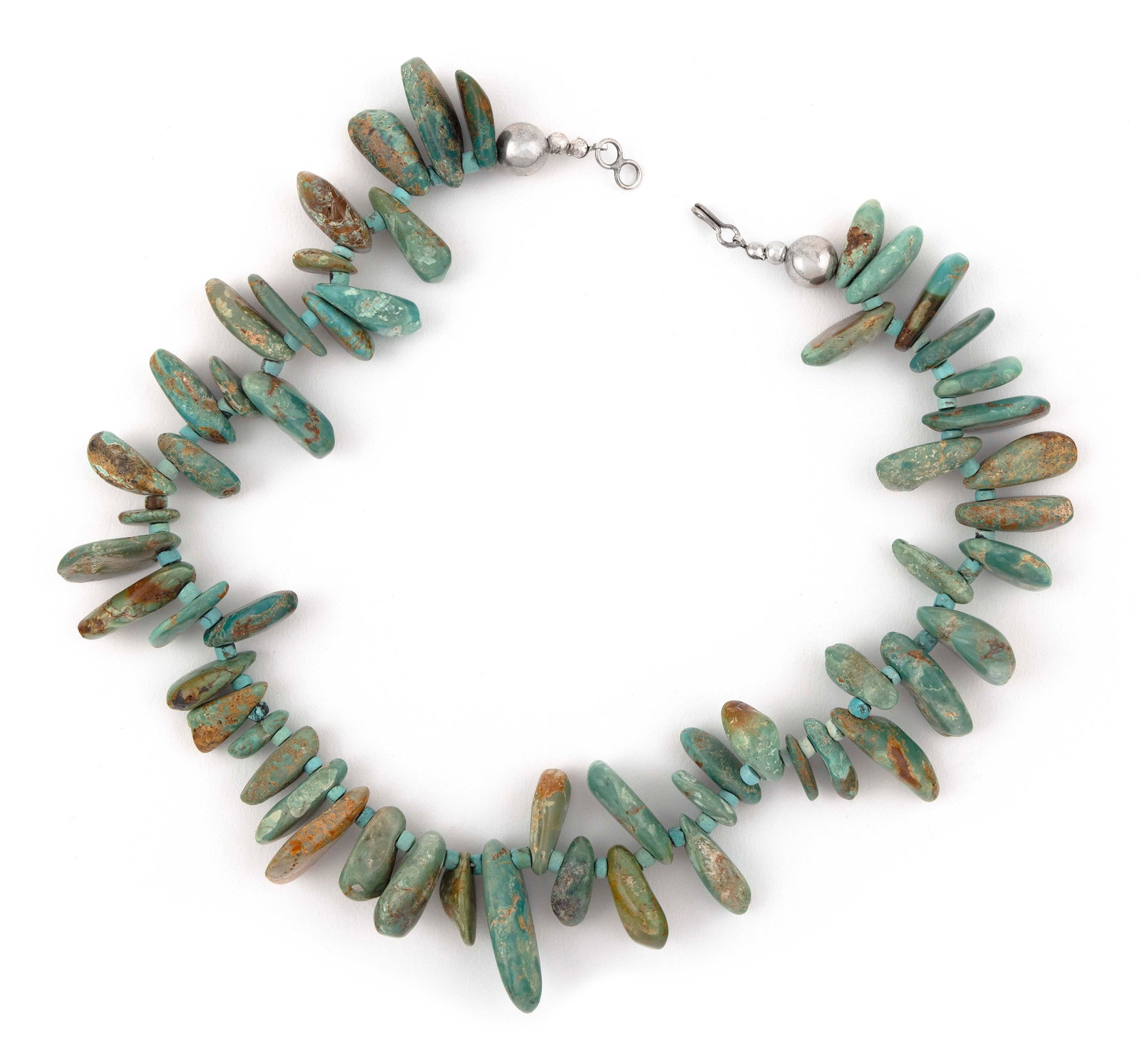 NAVAJO STERLING SILVER AND TURQUOISE SLAB CHOKER Mid-20th Century Approx. 146 total grams: NAVAJO STERLING SILVER AND TURQUOISE SLAB CHOKER Mid-20th Century A strand of large Royston turquoise stones is separated by small turquoise discs and ends in sterling silver beads. Length 21”. 