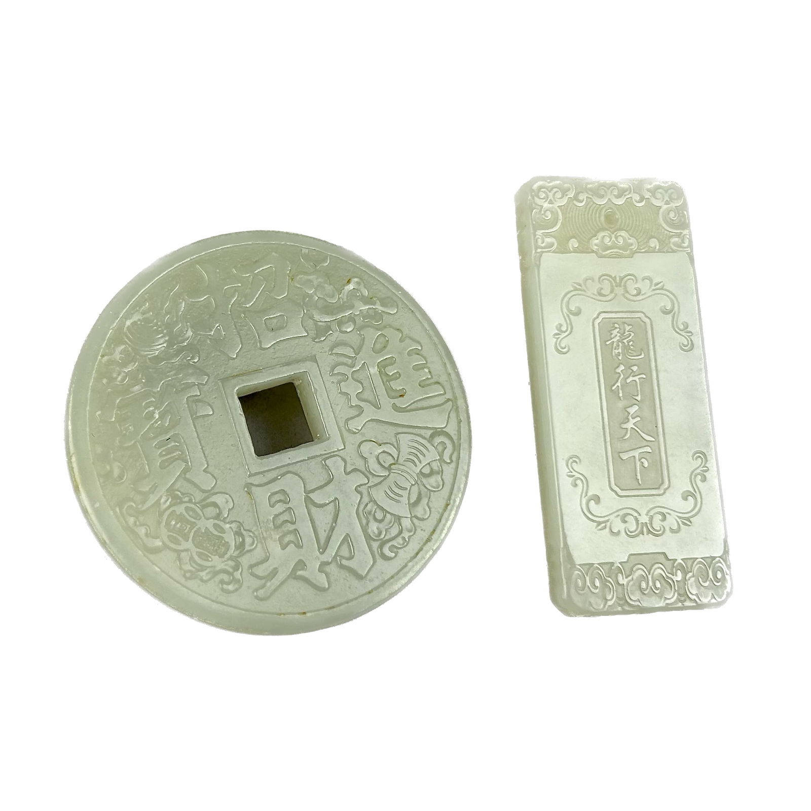 TWO CHINESE CARVED LIGHT CELADON JADE PENDANTS (1 of 5)