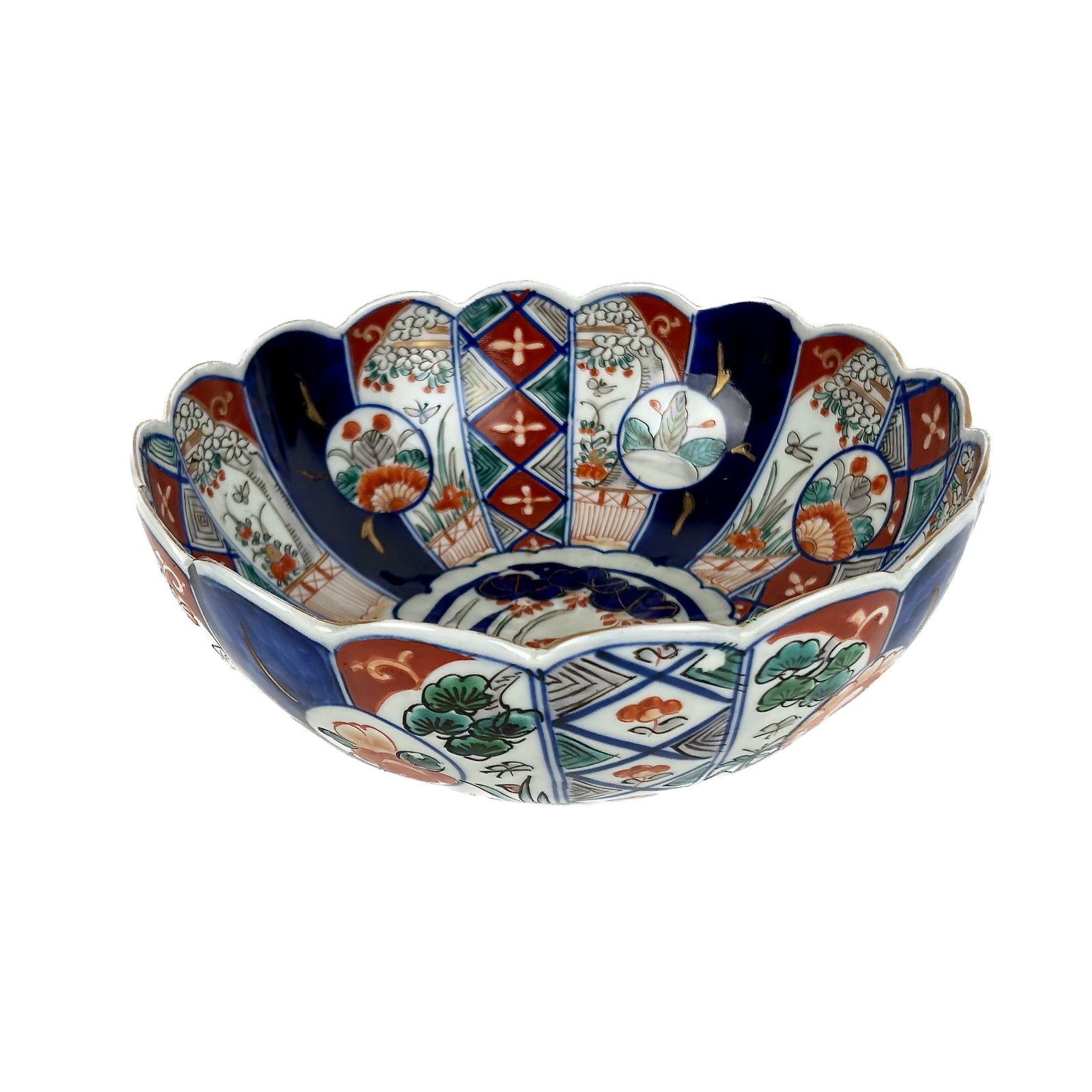JAPANESE IMARI PORCELAIN RIBBED FLORIFORM BOWL Late Meiji Period Height 4". Diameter 9.75".: JAPANESE IMARI PORCELAIN RIBBED FLORIFORM BOWL Late Meiji Period Alternating paneled decoration. Height 4". Diameter 9.75".