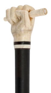 FIST CLENCHING A SPYGLASS CANE 19th Century Length 36.5".: FIST CLENCHING A SPYGLASS CANE19th CenturyMarine ivory handle, probably walrus ivory, carved as a clenched right fist clutching a three-draw scope, the scope with finely engraved lines and an inlaid m