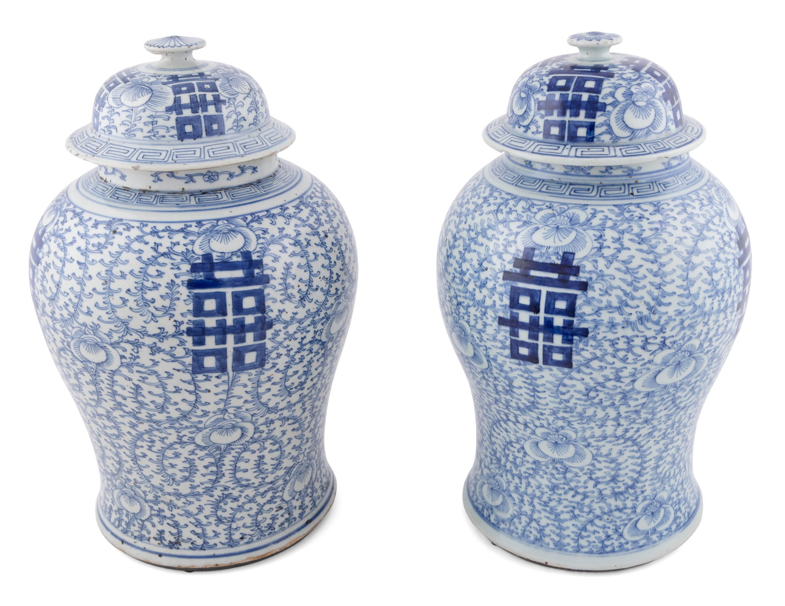 PAIR OF CHINESE BLUE AND WHITE PORCELAIN TEMPLE VASES Late 19th/Early 20th Century Heights 17".: PAIR OF CHINESE BLUE AND WHITE PORCELAIN TEMPLE VASES Late 19th/Early 20th Century Shou decoration against a lotus and scrolling vine-filled ground. Domed tops. Four-character Qianlong mark and export