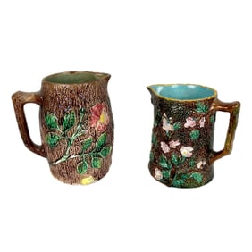 TWO ENGLISH MAJOLICA PITCHERS Second Half of the 19th Century Heights 7" and 8".