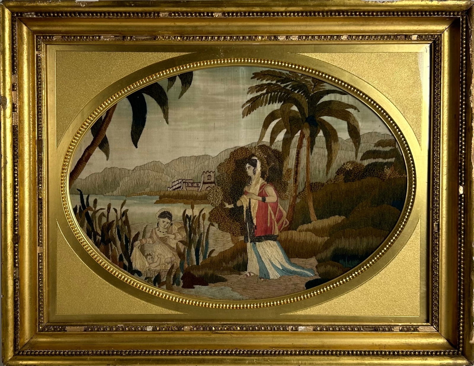 NEEDLEWORK PICTURE OF MOSES IN THE BULLRUSHES England, Early 19th Century Oval aperture 12" x 17". (1 of 3)