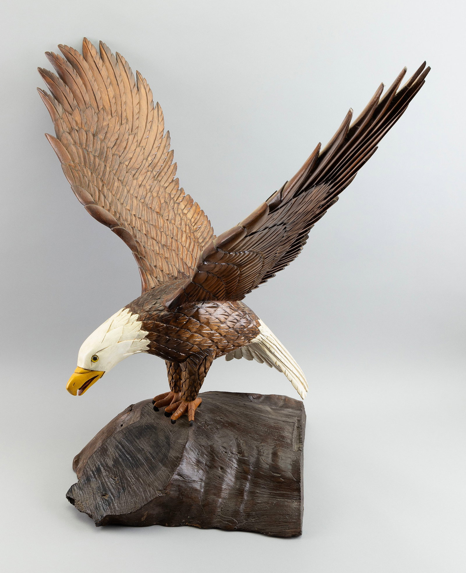 JOE WAISGERBER BALD EAGLE CARVING Massachusetts, d. 2022 Height 26". Width 24". Depth 28".: JOE WAISGERBER BALD EAGLE CARVING Massachusetts, d. 2022 Glass eyes. Mounted on a driftwood base. Height 26". Width 24". Depth 28".
