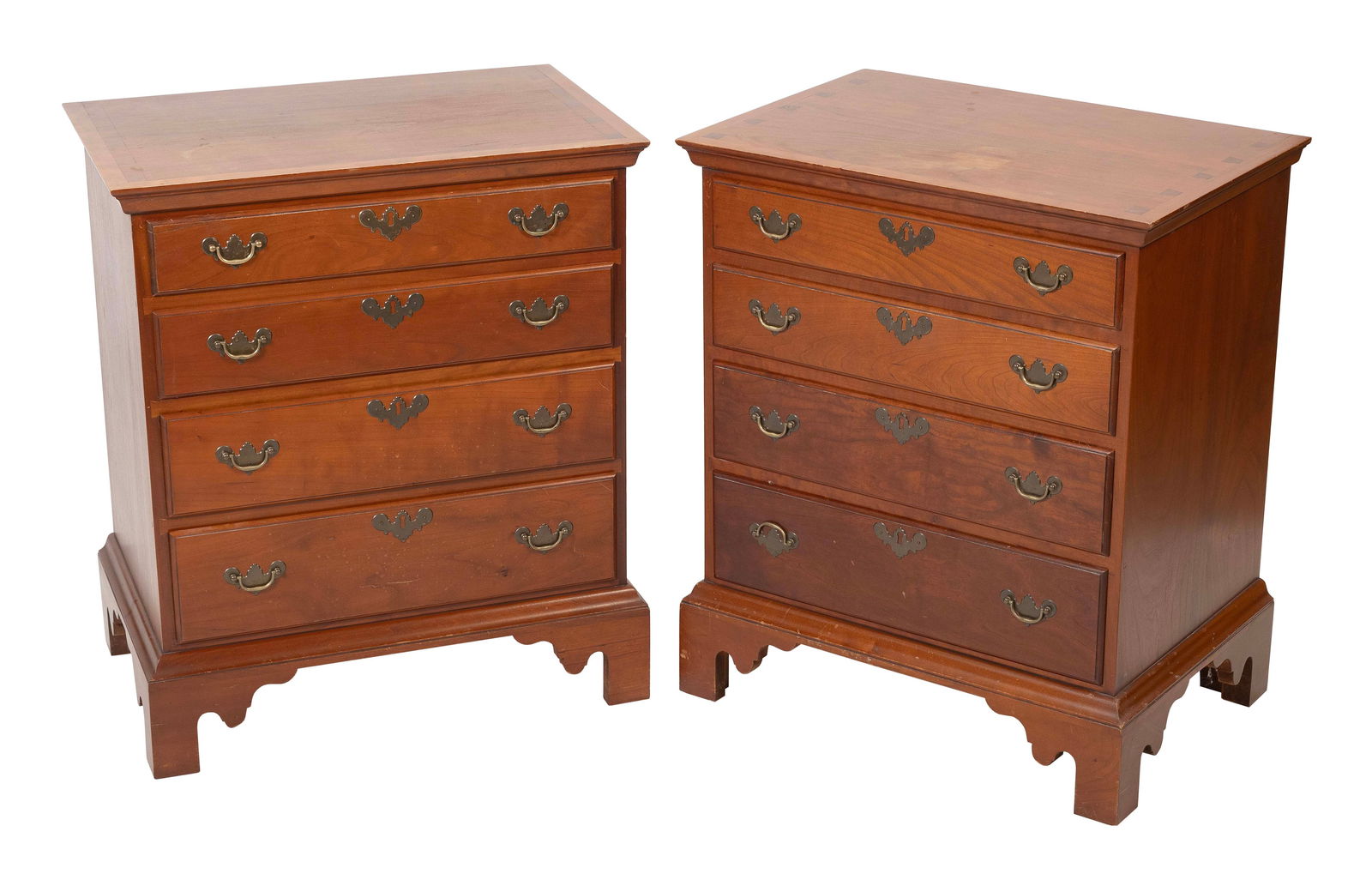 PAIR OF ELDRED WHEELER BACHELOR'S CHESTS Massachusetts, 20th Century Heights 29". Widths 24". Depths: PAIR OF ELDRED WHEELER BACHELOR'S CHESTSMassachusetts, 20th CenturyIn cherry, with four graduated full-width drawers and a shaped bracket base. Original Eldred Wheeler label inside a drawer.Heights 29