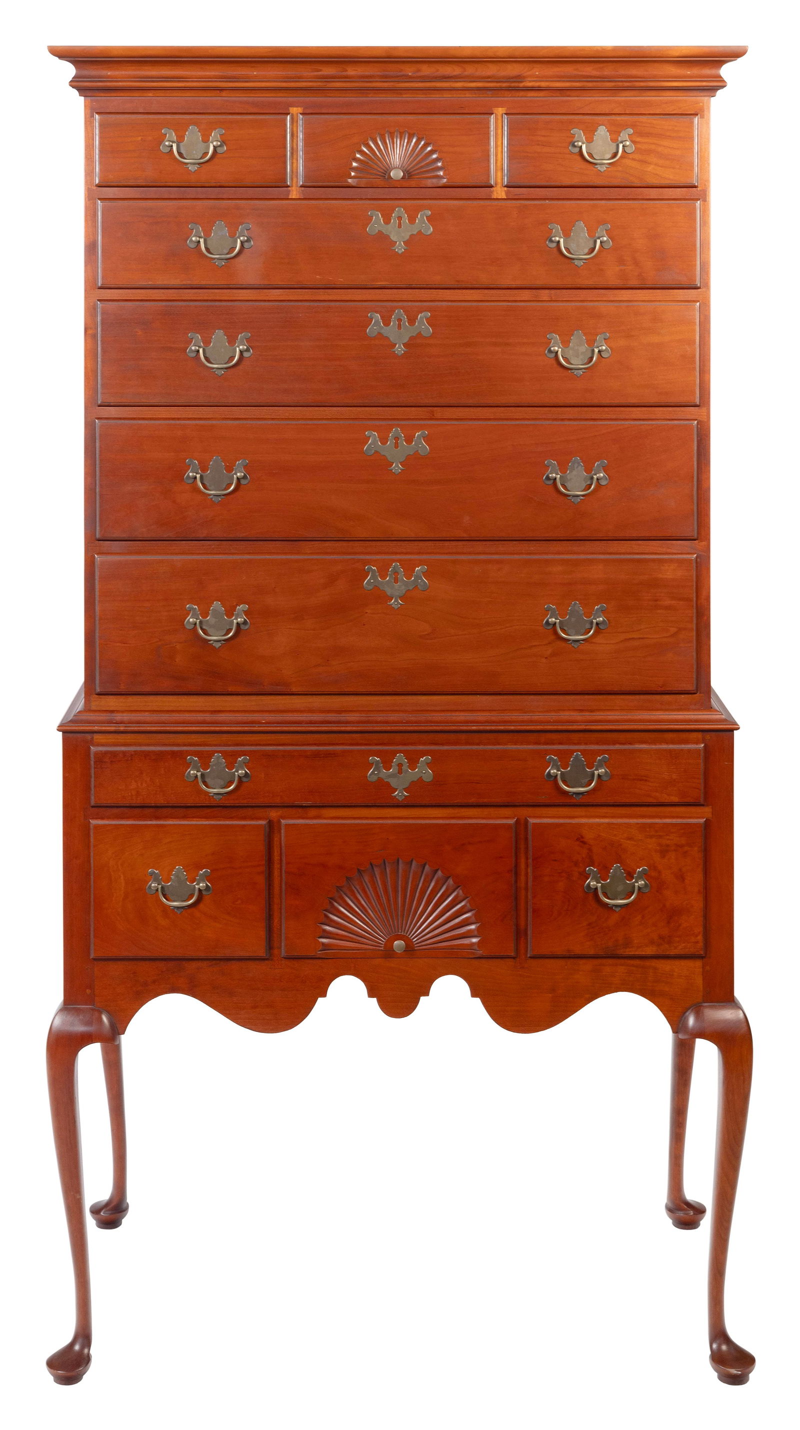 ELDRED WHEELER TWO-PART HIGHBOY Massachusetts, 20th Century Height 71.5". Width 36". Depth 19".: ELDRED WHEELER TWO-PART HIGHBOYMassachusetts, 20th CenturyIn cherry. Upper case with three side-by-side drawers, the central with shell carving, over four graduated full-width drawers. Lower case with