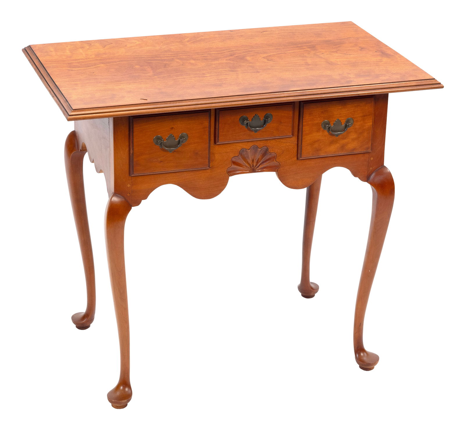 ELDRED WHEELER LOWBOY Massachusetts, 20th Century Height 28". Width 31". Depth 19".: ELDRED WHEELER LOWBOYMassachusetts, 20th CenturyIn maple. Three side-by-side drawers. Shaped skirt with central shell carving. Cabriole legs end in pad feet. Original Eldred Wheeler label inside a dra