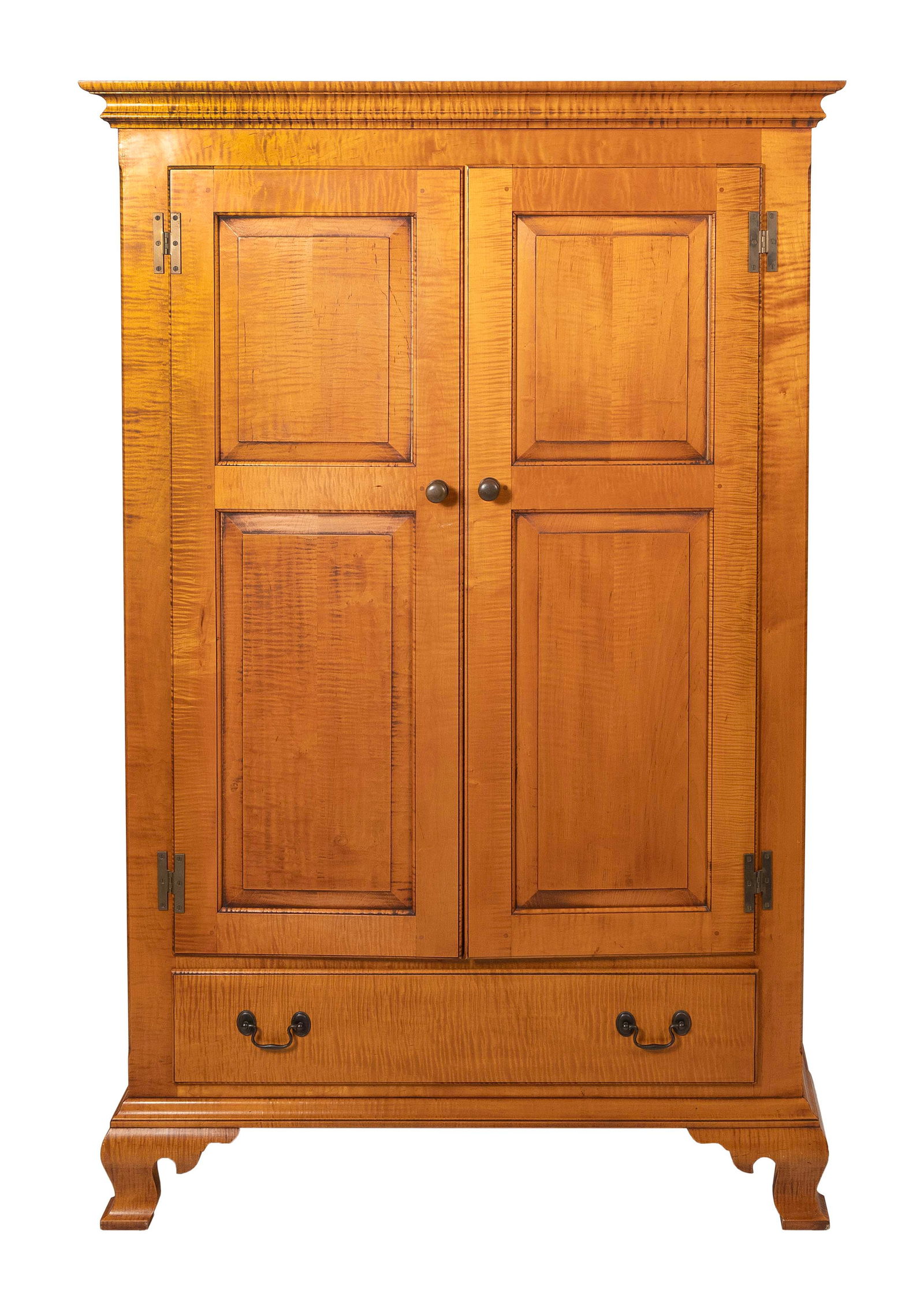 ELDRED WHEELER CUPBOARD Massachusetts, 20th Century Height 67". Width 43". Depth 26".: ELDRED WHEELER CUPBOARDMassachusetts, 20th CenturyIn tiger maple. Two paneled doors over a full-width drawer. Ogee bracket feet. Original Eldred Wheeler label inside drawer.Height 67". Width 43". Dept
