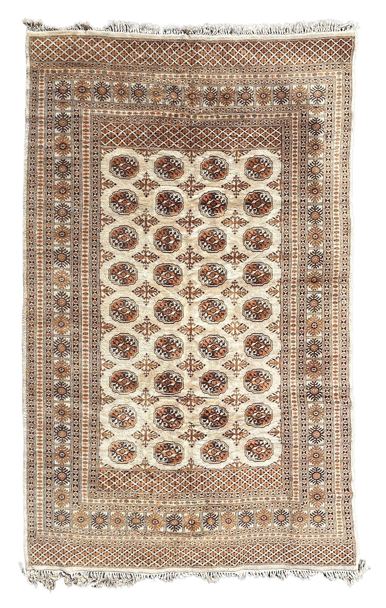 BOKHARA DESIGN RUG: 6’3" X 9’0" Third Quarter of the 20th Century: BOKHARA DESIGN RUG: 6’3" X 9’0" Third Quarter of the 20th Century Ivory field with nine columns of tribal guls and orange, gold, midnight blue and ivory stylized cruciform motifs. Stylized