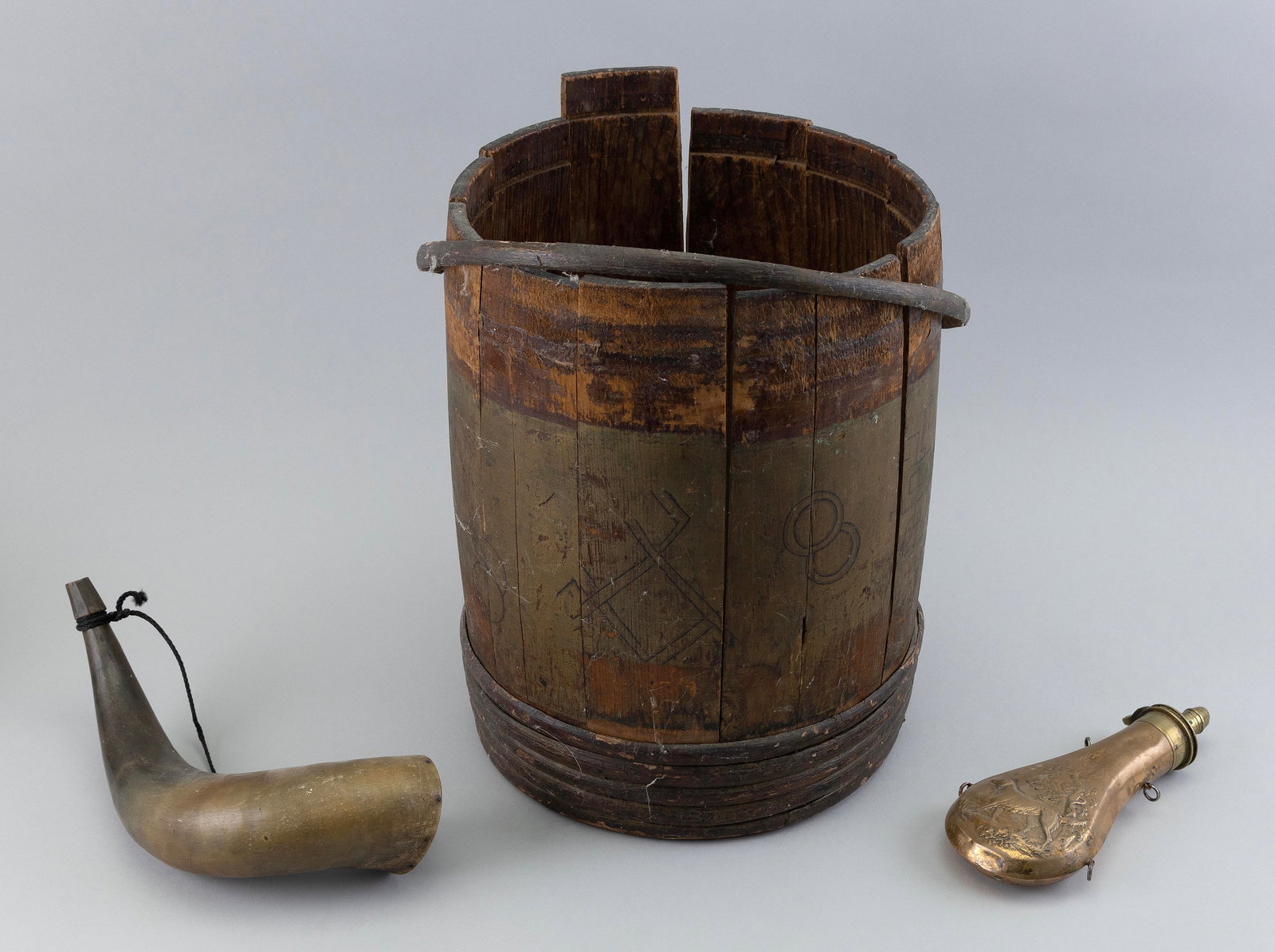 THREE GUN POWDER-RELATED OBJECTS 19th Century Lengths from 8" to 13".: THREE GUN POWDER-RELATED OBJECTS 19th Century 1) Wooden keg with original orange Laflin & Rand Powder Co. label. 2) English copper powder flask with dog decoration. 3) Undecorated powder horn. Lengths