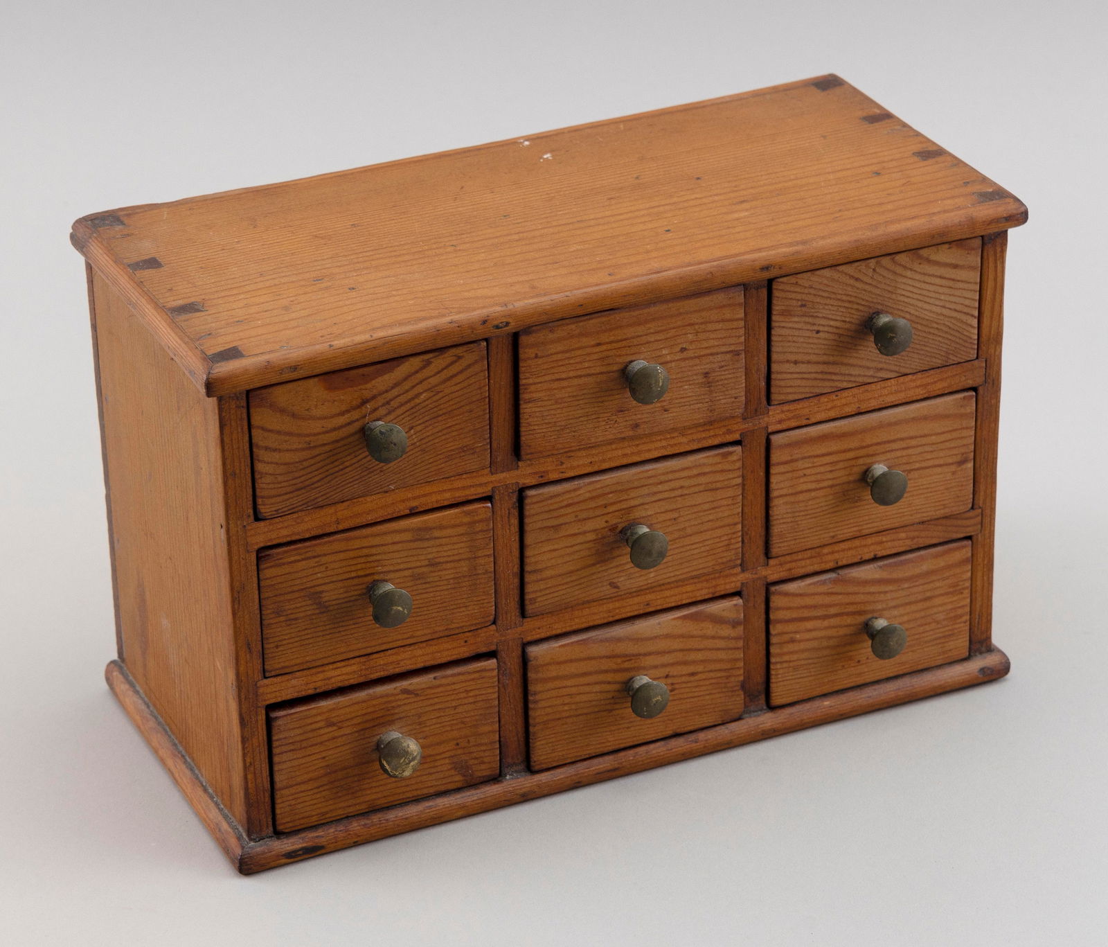 NINE-DRAWER SPICE BOX America, 19th Century Height 6.5". Width 10". Depth 4.75". (1 of 3)