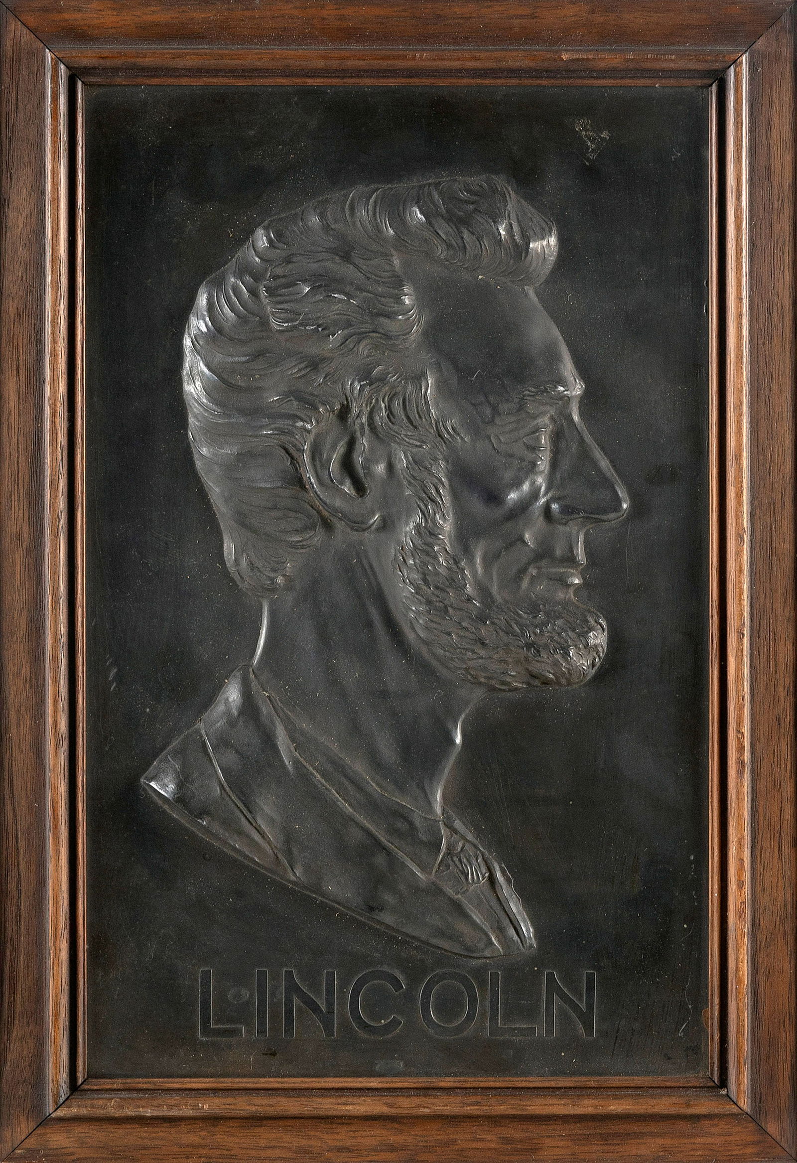 BUST PROFILE OF ABRAHAM LINCOLN Early 20th Century Cast aluminum, 12.5" x 8". Framed 14.5" x 10". (1 of 2)