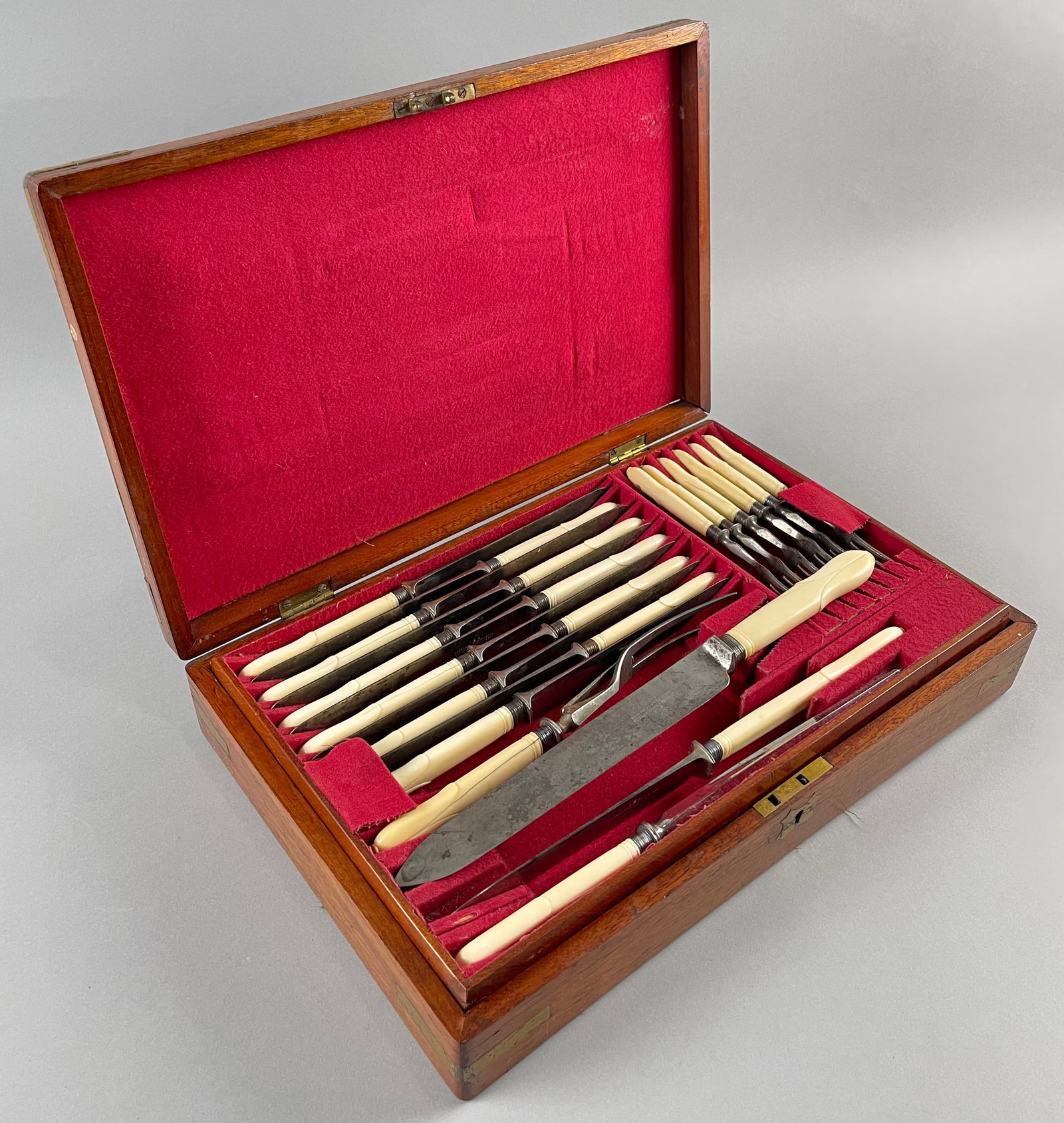 JOSEPH RODGERS & SONS CASED CUTLERY SET 19th Century Case 16" x 10".: JOSEPH RODGERS & SONS CASED CUTLERY SET 19th Century Bone handles. Mahogany case with brass fittings. Case 16" x 10".