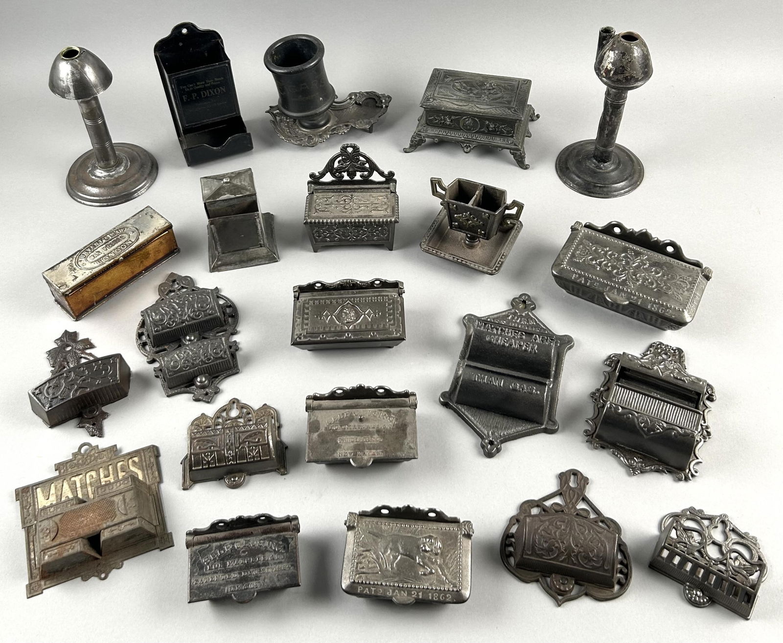 TWENTY-TWO CAST IRON AND TIN MATCH SAFES AND HOLDERS Second Half of the 19th Century Heights from (1 of 7)