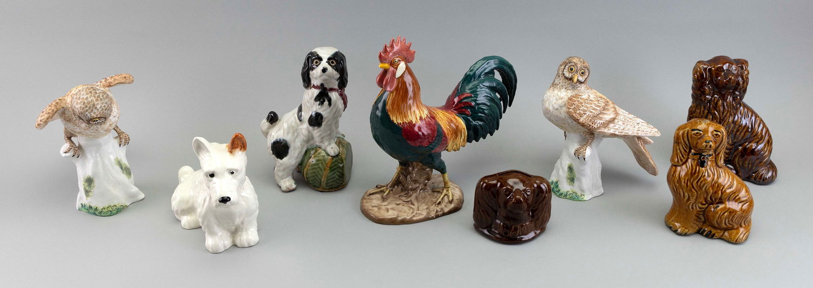 EIGHT PORCELAIN FIGURINES OF DOGS AND BIRDS 20th Century Heights from 3.5" to 10.25". (1 of 5)