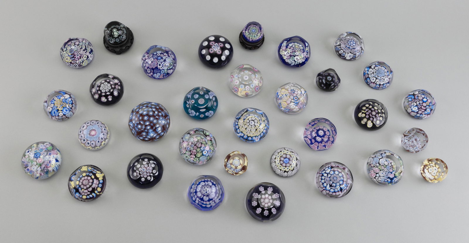 THIRTY-TWO PAIRPOINT GLASS PAPERWEIGHTS Bourne, Massachusetts, 20th Century Heights from 1" to 2". (1 of 2)