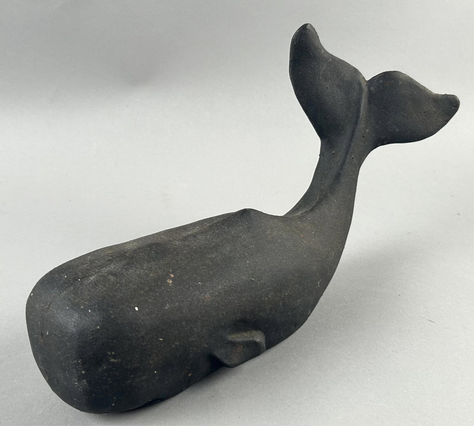 CAST IRON WHALE DOORSTOP 20th Century Length 13".: CAST IRON WHALE DOORSTOP 20th Century Painted black. Length 13".