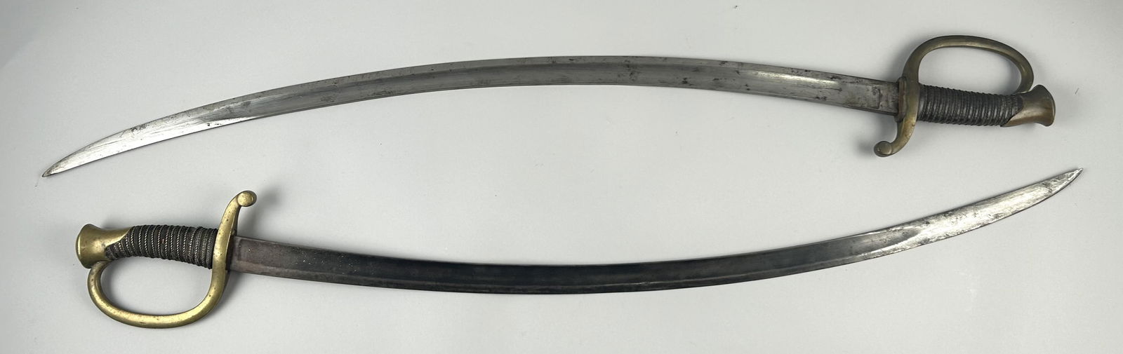 TWO CIVIL WAR-ERA CAVALRY SWORDS AND SCABBARDS Circa 1860 Length of blade 31.5". Total length (1 of 5)