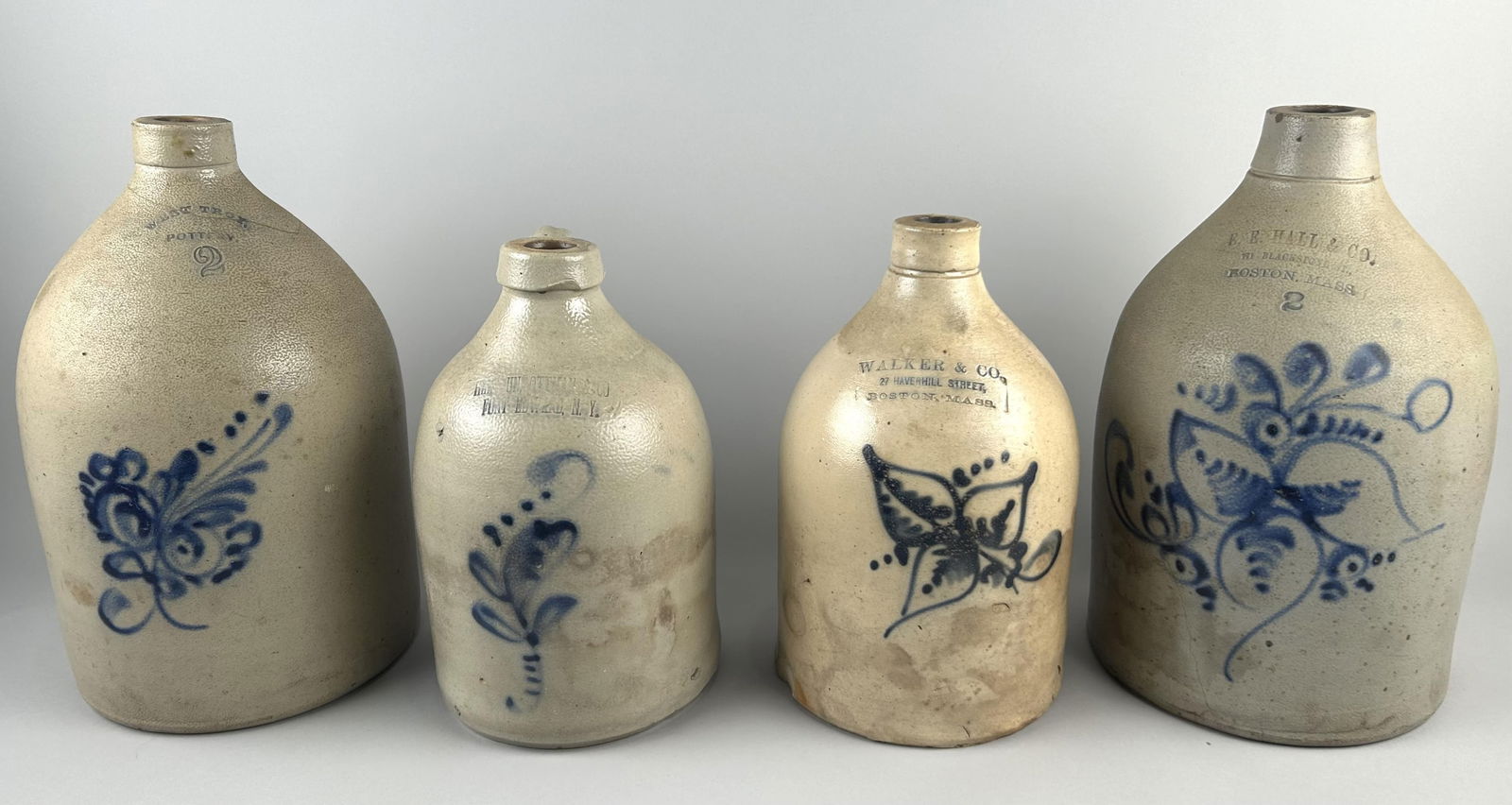 FOUR STONEWARE JUGS 19th Century Heights from 12" to 15". (1 of 2)