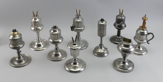 NINE AMERICAN PEWTER LAMPS, MOSTLY WHALE OIL Mid-19th Century Heights from 7" to 8.25".