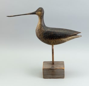 MARK MCNAIR CARVING OF A WILLET Craddockville, Virginia, 1950- Length 16.5". On wood stand.