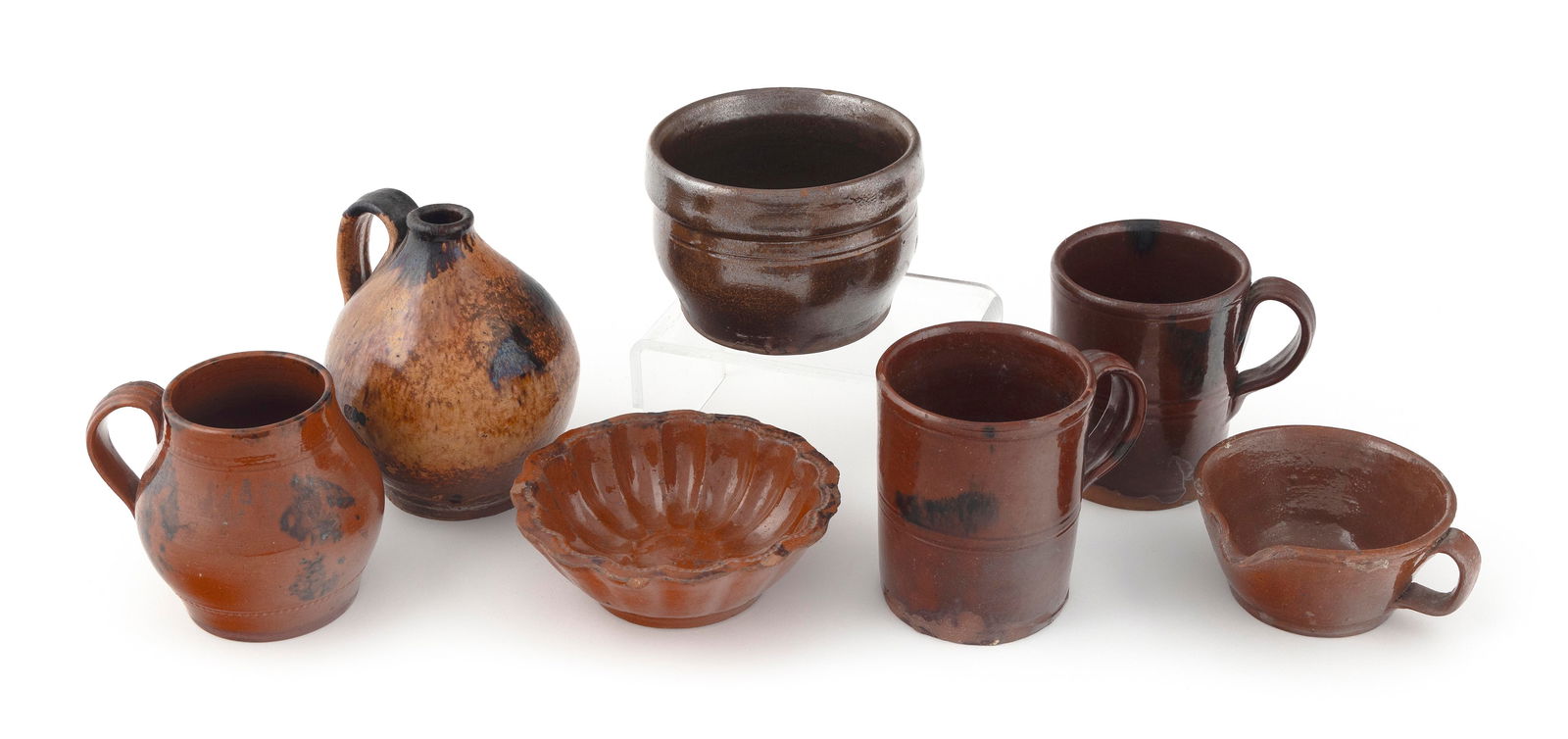 SEVEN PIECES OF REDWARE, MOSTLY OHIO Mid-19th Century Heights to 5.5". (1 of 2)
