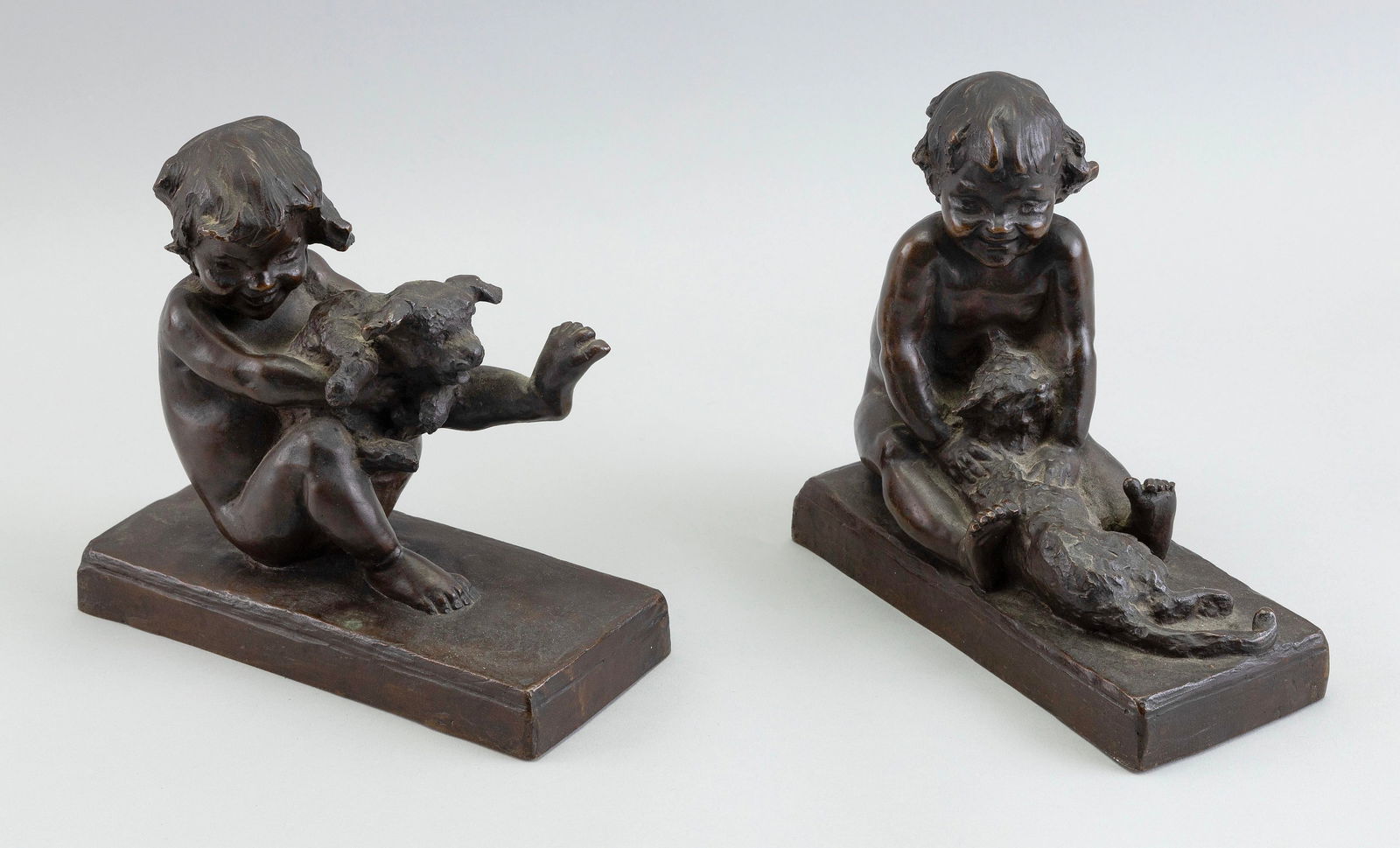 EDITH BARRETTO PARSONS (New York, 1878-1956), Pair of bookends modeled as a young girl and her (1 of 2)