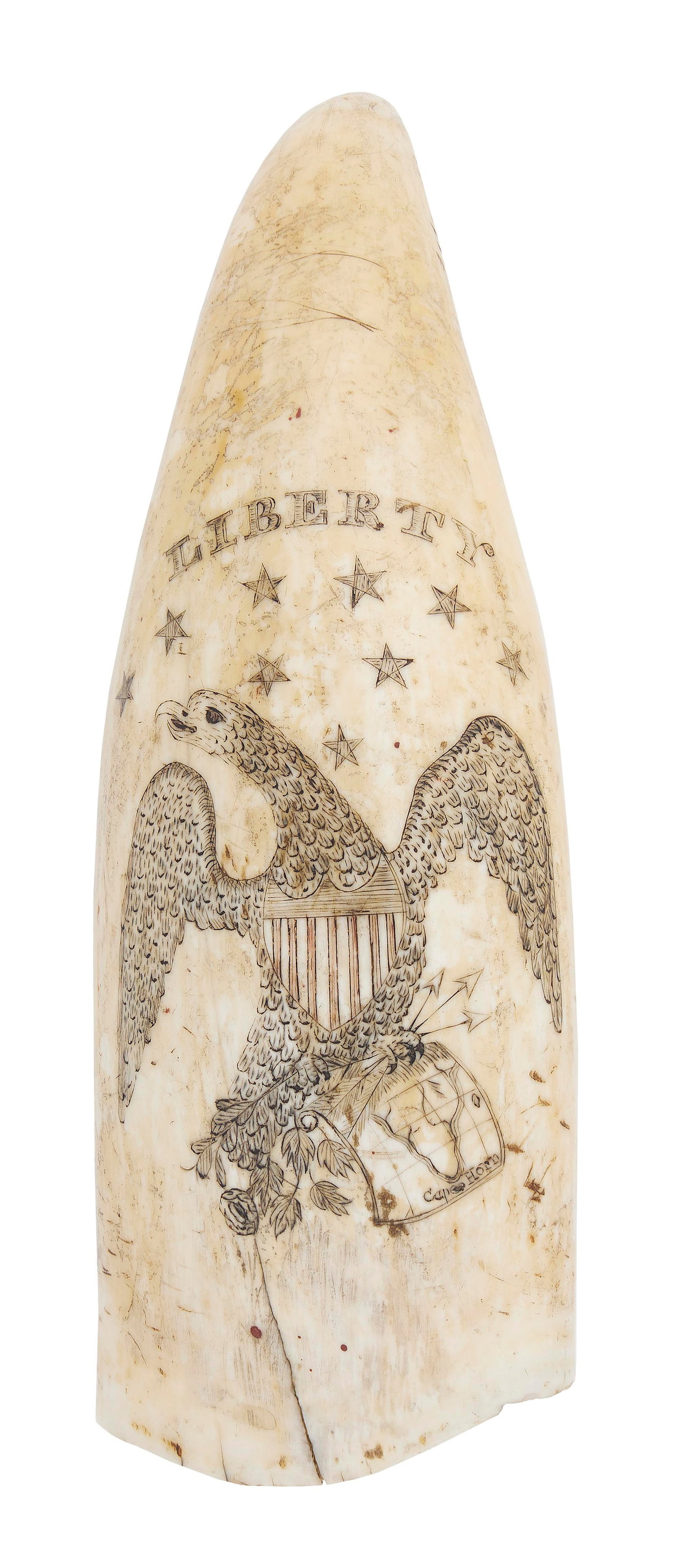 SCRIMSHAW WHALE'S TOOTH WITH A PATRIOTIC EAGLE AND SHIP PORTRAIT Mid-19th Century Length 6.5".: SCRIMSHAW WHALE'S TOOTH WITH A PATRIOTIC EAGLE AND SHIP PORTRAIT Mid-19th Century Obverse depicts "Liberty" and stars above a spread-wing eagle with a red-striped Liberty shield at its breast, and arr