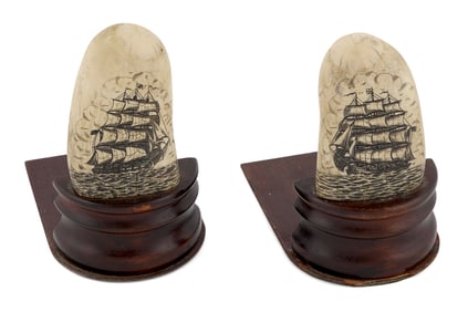 PAIR OF SCRIMSHAW WHALE'S TEETH BOOKENDS Late 19th/Early 20th Century Total heights 6.5".