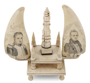 PAIR OF SCRIMSHAW WHALE'S TEETH ON AN ELABORATE WHALEBONE STAND Mid-19th Century Total height 8.5".