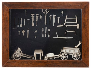 DISPLAY OF MINIATURE BONE CARVINGS Circa 1878 Shadow box 16.75" x 21.75".