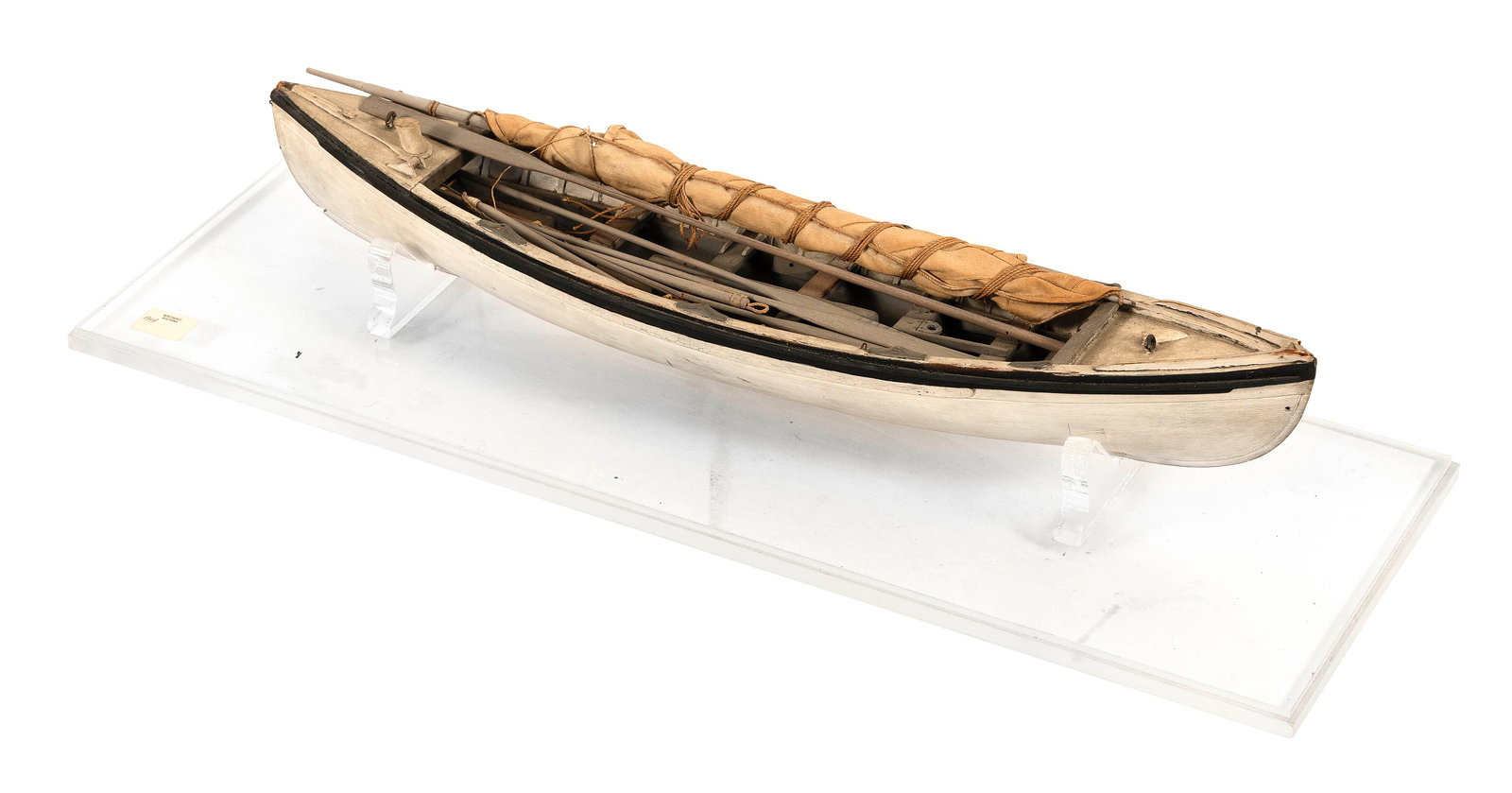 PLANK-ON-FRAME MODEL OF A WHALEBOAT First Half of the 20th Century Height on stand 4.25". Length: PLANK-ON-FRAME MODEL OF A WHALEBOATFirst Half of the 20th CenturyComplete with mast, sails, oars, harpoons, etc. Displayed on a contemporary plexiglass stand.Height on stand 4.25". Length 20".