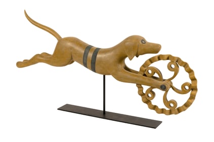 WOODEN SCULPTURE OF A RUNNING DOG JAGGING WHEEL BY MARK PERRY Nantucket, Massachusetts, Contemporary