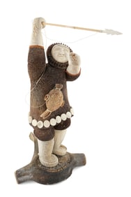 ALASKAN NATIVE CARVED WHALEBONE FIGURE OF A HUNTER HOLDING A SPEAR 20th Century Height 28.75".