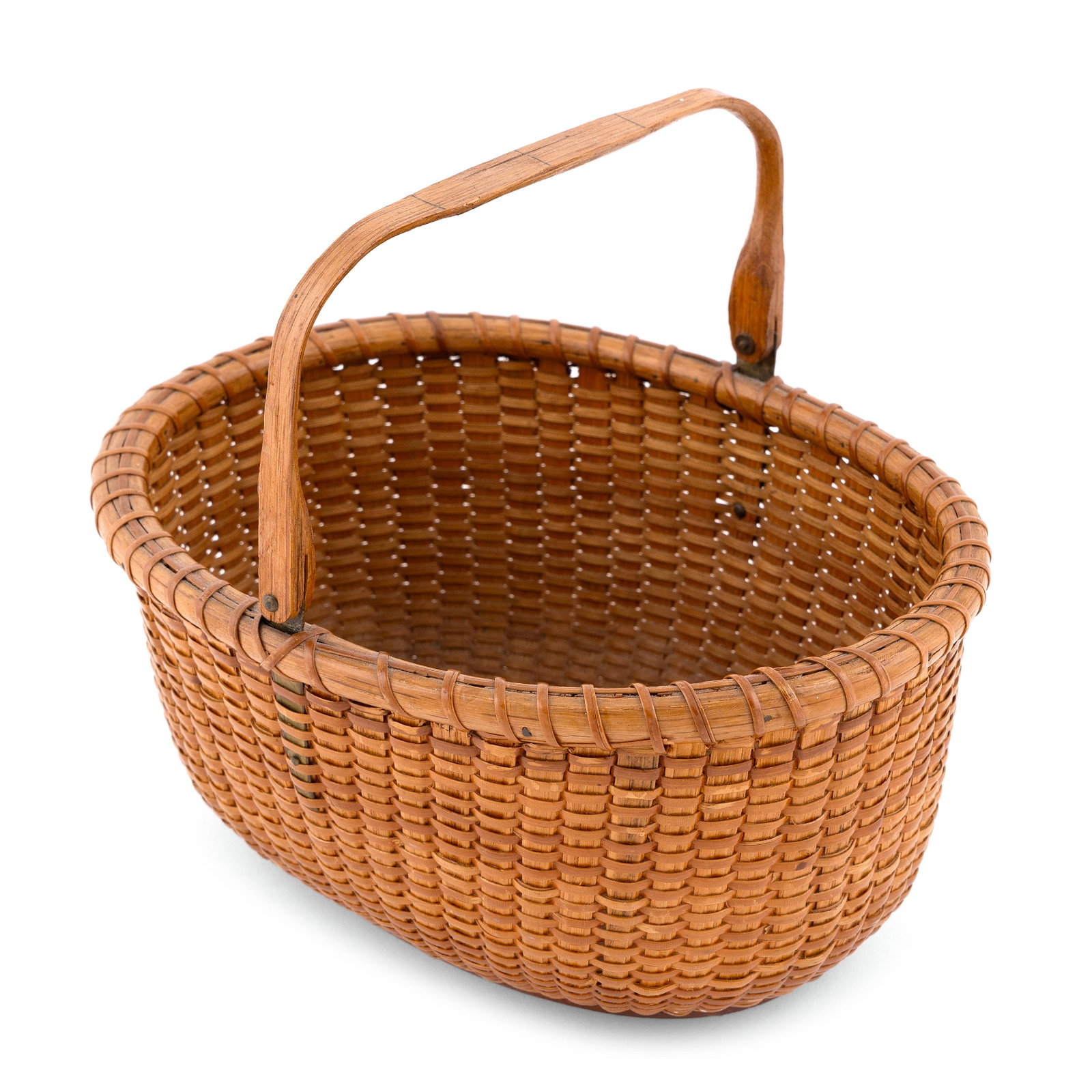 MITCHELL RAY NANTUCKET BASKET Nantucket, 1877-1956: MITCHELL RAY NANTUCKET BASKET Nantucket, 1877-1956 Oval, with swing handle. Label on underside of base printed "Made by Mitchell Ray. Nantucket [...]". Length 10". Width 7.5". Height (not including ha