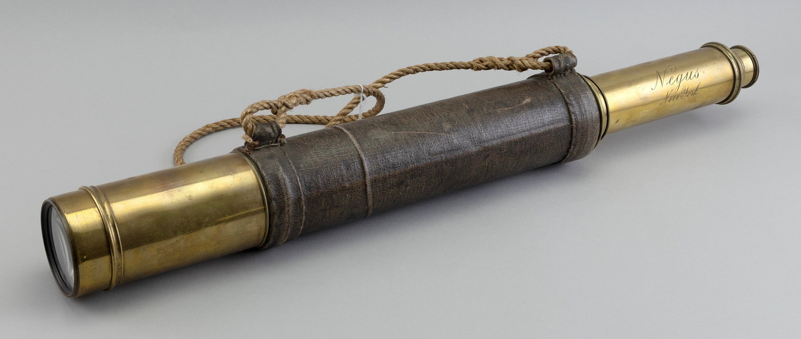 NEGUS SINGLE-DRAW TELESCOPE 19th Century Length 21.75".: NEGUS SINGLE-DRAW TELESCOPE 19th Century Purportedly belonged to a whaling captain. Brass tube with canvas wrap. Engraved "Negus New York". Length 21.75". Provenance: The Collection of Paul Vardeman.