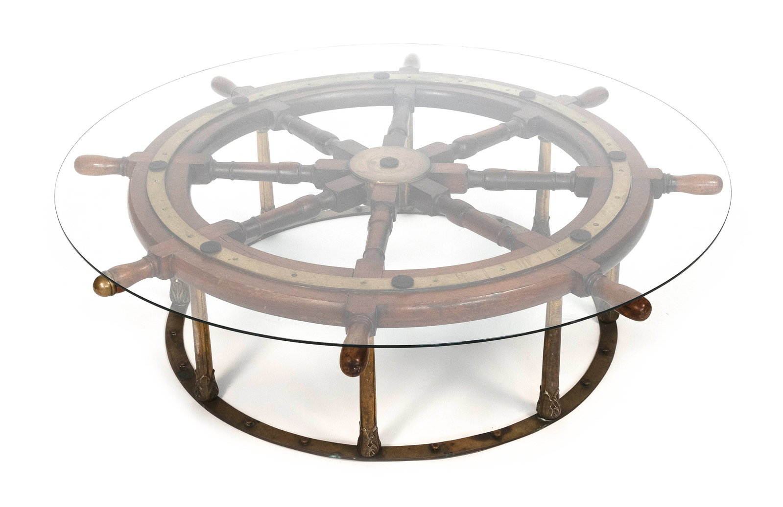 SHIP'S WHEEL COFFEE TABLE Late 19th/Early 20th Century Height 15.25". Diameter 54".: SHIP'S WHEEL COFFEE TABLE Late 19th/Early 20th Century Walnut eight-spoke wheel on a brass base. Glass top. Height 15.25". Diameter 54".