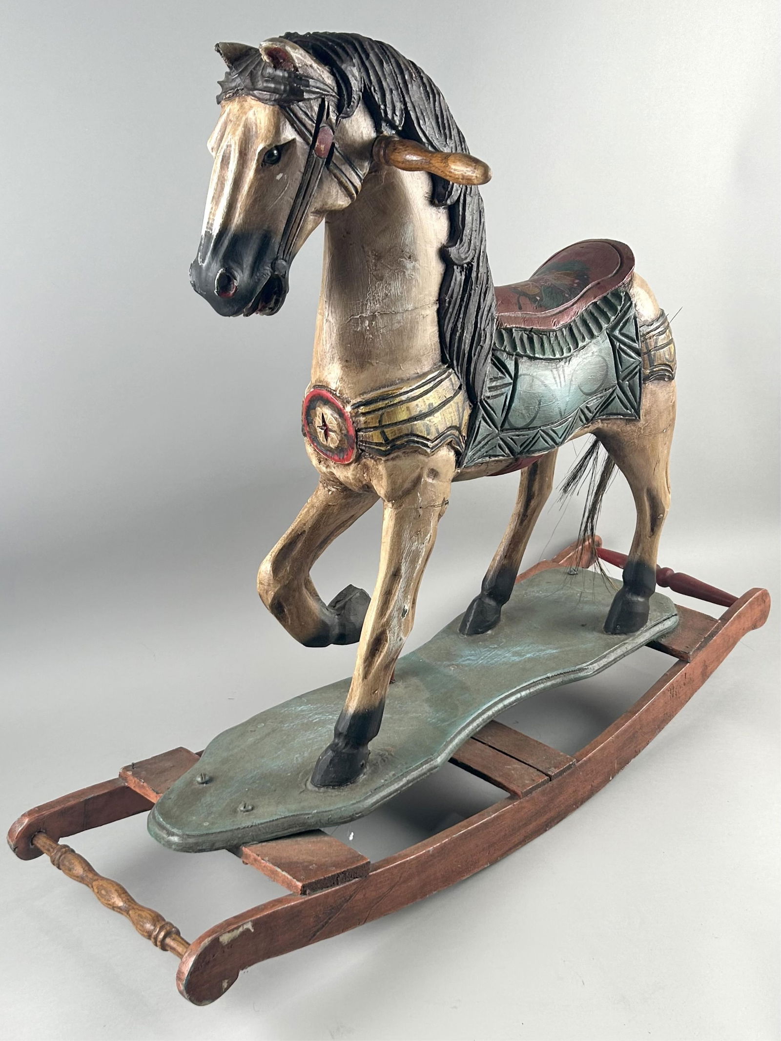 CARVED AND PAINTED WOODEN ROCKING HORSE Late 20th Century Height 27". Length 32.5". Width 10.25". (1 of 3)