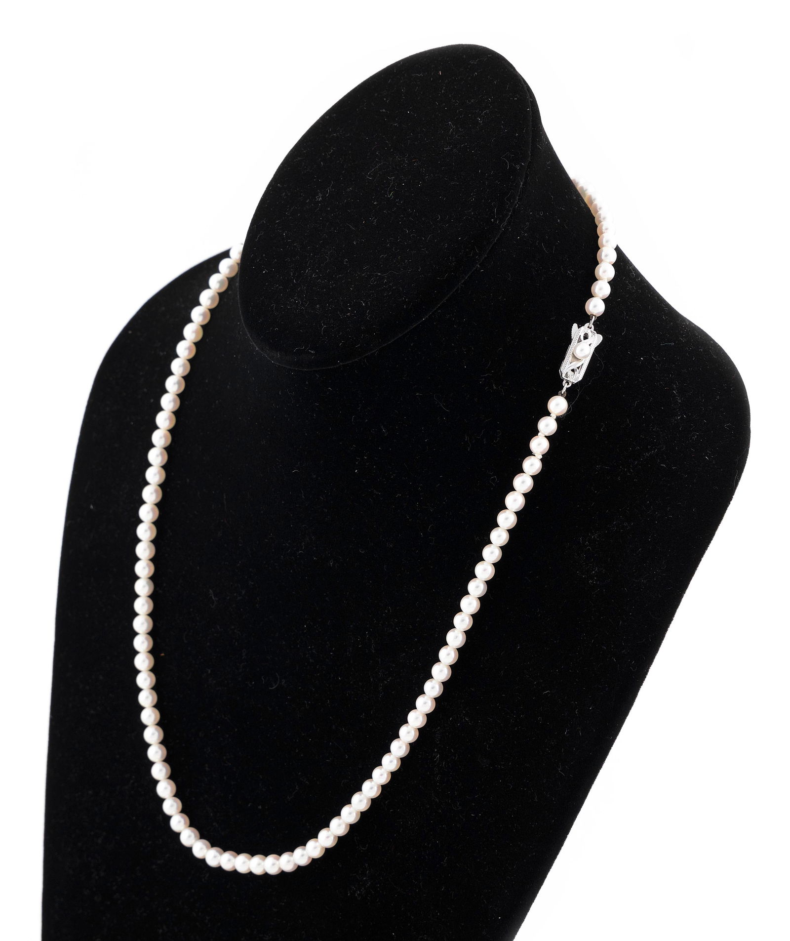 MIKIMOTO 14KT WHITE GOLD AND PEARL NECKLACE: MIKIMOTO 14KT WHITE GOLD AND PEARL NECKLACEApprox. 5.0mm pearls. 14kt white gold rectangular clasp set with one approx. 4.0mm pearl. Stamped. Length 22".