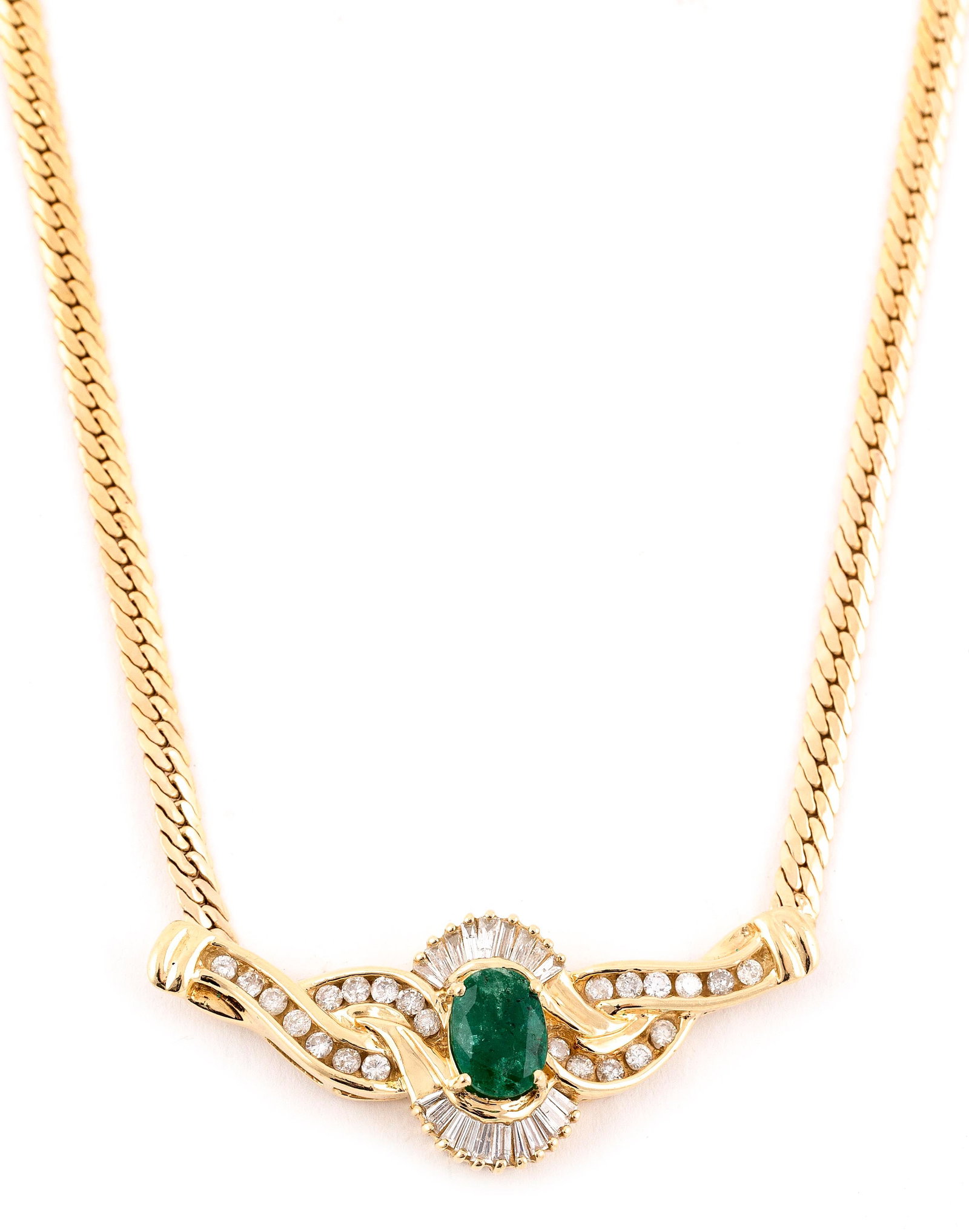14KT YELLOW GOLD, DIAMOND AND EMERALD NECKLACE Approx. 10.10 total dwt.: 14KT YELLOW GOLD, DIAMOND AND EMERALD NECKLACE One approx. 6.0 x 8.0mm oval-cut emerald, approx. 1.00 ct., 20 tapered baguette-cut diamonds and 23 round-cut diamonds. Diamonds approx. 1.00 ctw. Lobste