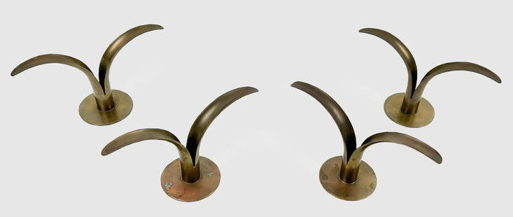 FOUR IVAR ÅLENIUS-BJÖRK FOR YSTAD-METALL "LILY" BRASS CANDLE HOLDERS Sweden, Circa 1960: FOUR IVAR ÅLENIUS-BJÖRK FOR YSTAD-METALL "LILY" BRASS CANDLE HOLDERSSweden, Circa 1960Stamped for Ystad-Metall on base.Heights 4.75". Notes:The "Lily" candlestick (“Liljan” in Sw